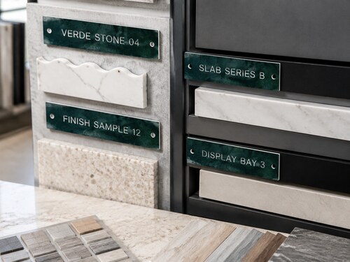 LYS-7130 green marble effect engraved stone slab finish sample and display bay labels in an architectural material library